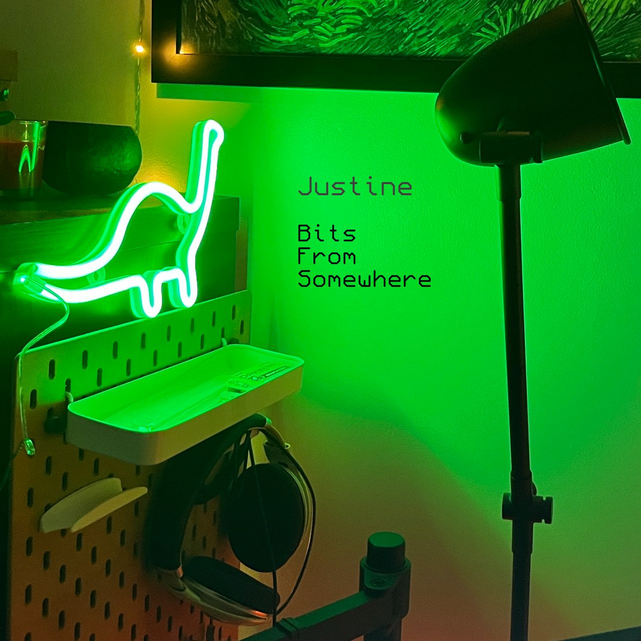 A photograph a green neon shining on my wall, in the shape of a dinosaur.